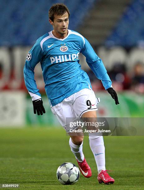 Danko Lazovic of PSV Eindhoven runs with the ball during the UEFA Champions League Group D match between Atletico Madrid and PSV Eindhoven at the...