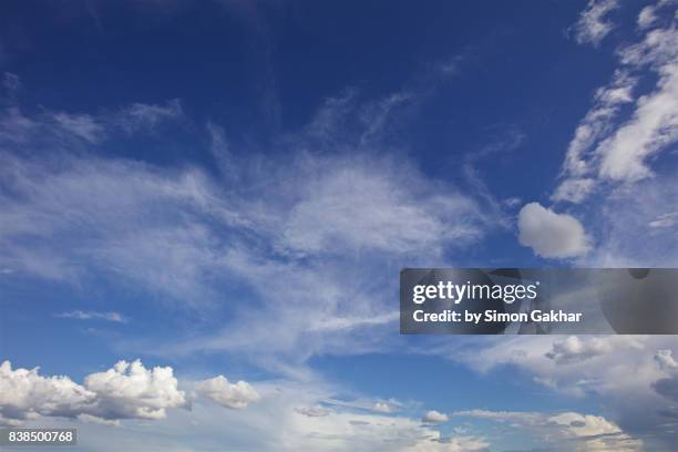 poetic blue sky cloudscape - wispy stock pictures, royalty-free photos & images
