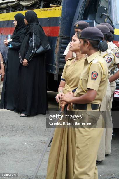 Police wait outside the Oberoi Hotel on November 28, 2008 in Mumbai, India. Following terrorist attacks on three locations in the city, troops are...