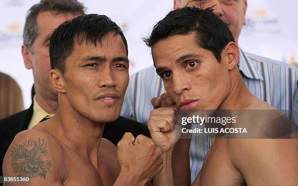 Boxers Edgar Sosa of Mexico and Juan Rubillar of the Philippines, pose for pictures after the weigh-in in Mexico City, on November 28, 2008. The two...