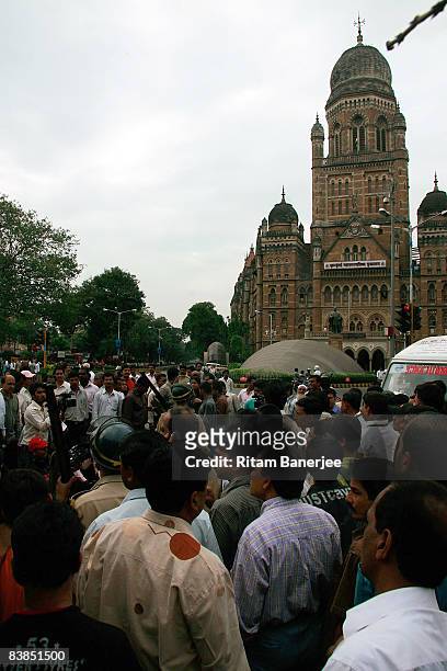 Crowds gather outside the Chatrapati Shivaji Terminus on November 28, 2008 in Mumbai, India. Following terrorist attacks on three locations in the...