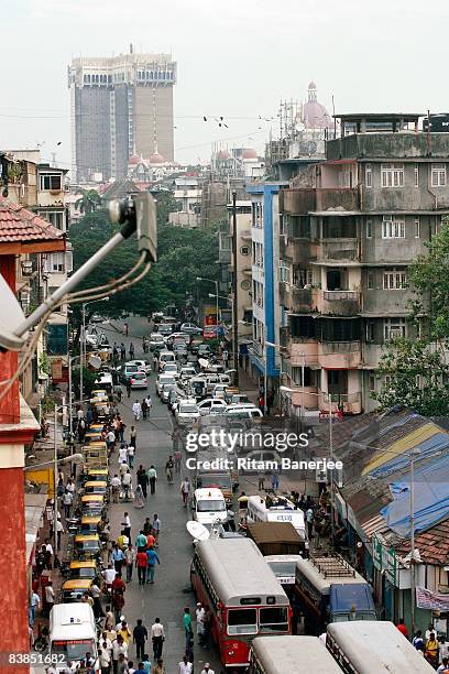 People gather outside the Nariman House in the Colaba Market Area on November 28, 2008 in Mumbai, India. Following terrorist attacks on three...