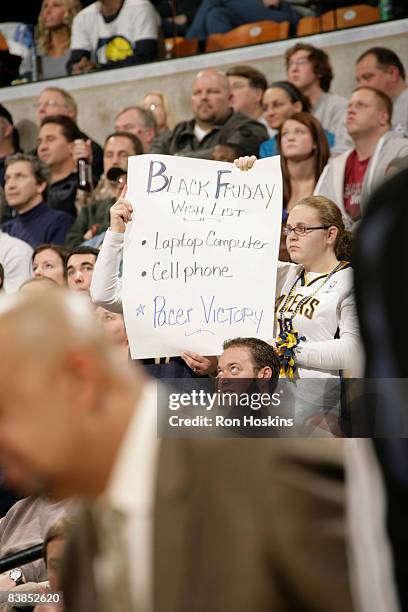 An Indiana Pacers fan shows her wish list during the game between the Pacers and the Charlotte Bobcats at Conseco Fieldhouse on November 28, 2008 in...