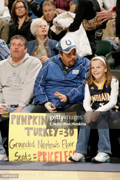 Two Indiana Pacers fans sit courtside for the Pacers game against the Charlotte Bobcats at Conseco Fieldhouse on November 28, 2008 in Indianapolis,...