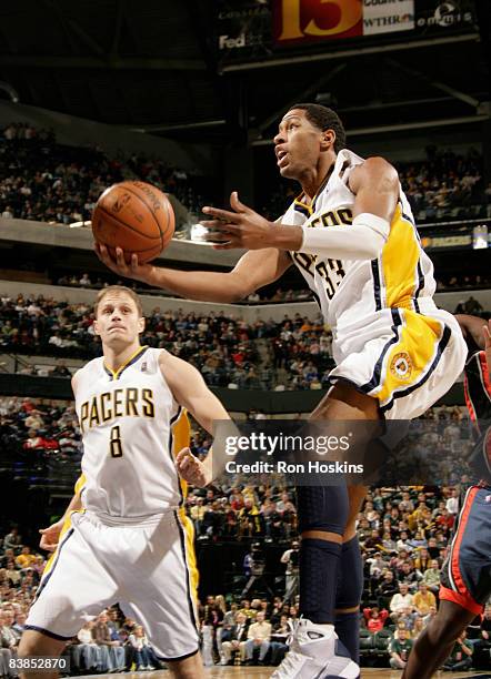 Danny Granger of the Indiana Pacers drives to the basket against the Charlotte Bobcats at Conseco Fieldhouse on November 28, 2008 in Indianapolis,...