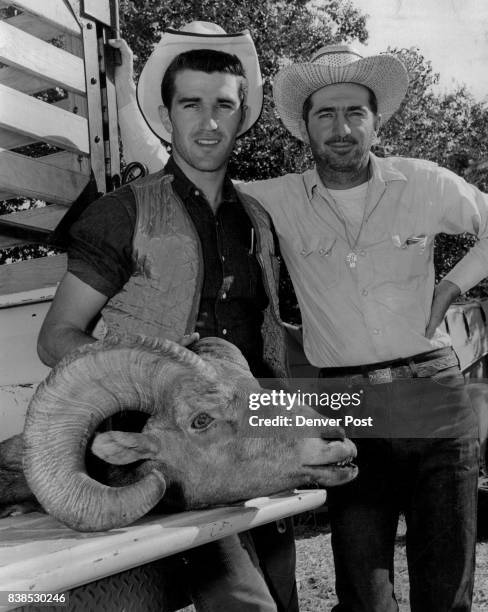 Full Curl Trophy Dale Leonard , of Longmont, displays the full curl ram he bagged in the Sangre de Cristo area on the second day of the bighorn sheep...