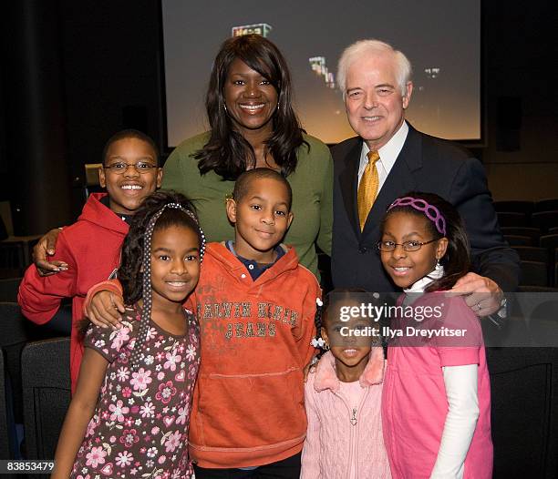 Nick Clooney poses for a photo with Benita Fitzgerald-Mosley and her family at the screening of "Moments That Changed Us: Steve Wozniak" at the...