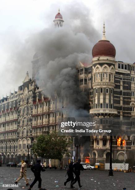 Firefighters attend to a fire as it burns at Taj Mahal Palace & Tower Hotel following an armed siege on November 29, 2008 in Mumbai, India. Indian...