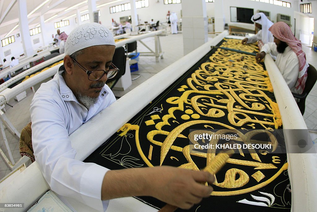 Saudi workers sew Islamic calligraphy in