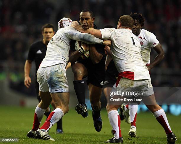 Joe Rokocoko of New Zealand is tackled by Tim Payne and James Haskell of England during the Investec Challenge match between England and New Zealand...