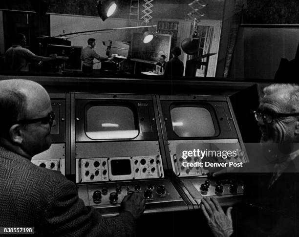 In the control room at the University of Denver TV Studios are John Seide, left engineer. And Prof.R. Russell Porter chairman of the radio and...