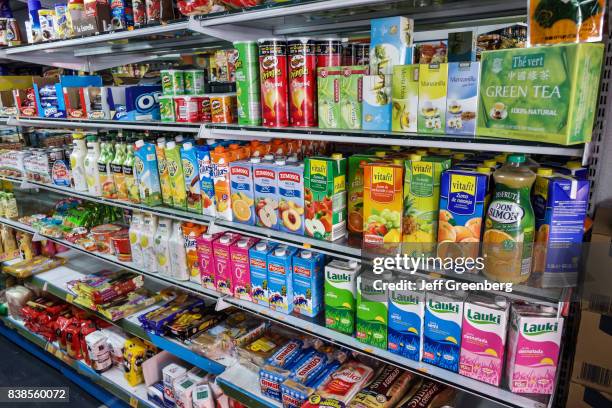 Shelves of drinks for sale inside a convenience store in Ronda de Atocha.