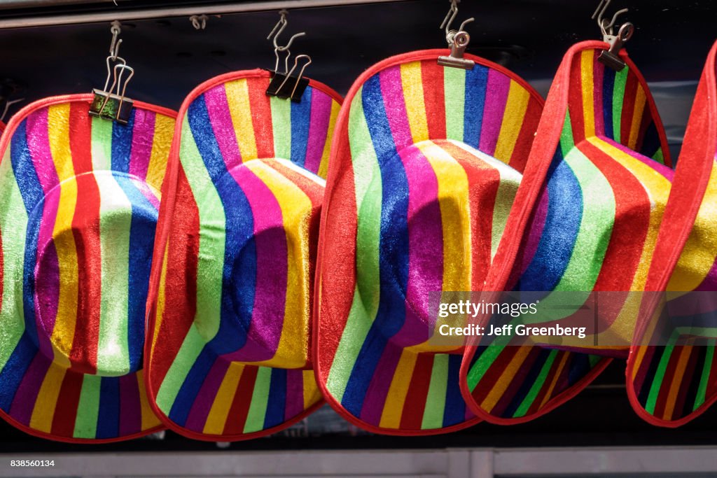 Rainbow hats for sale at a store in Calle de Alcalà.