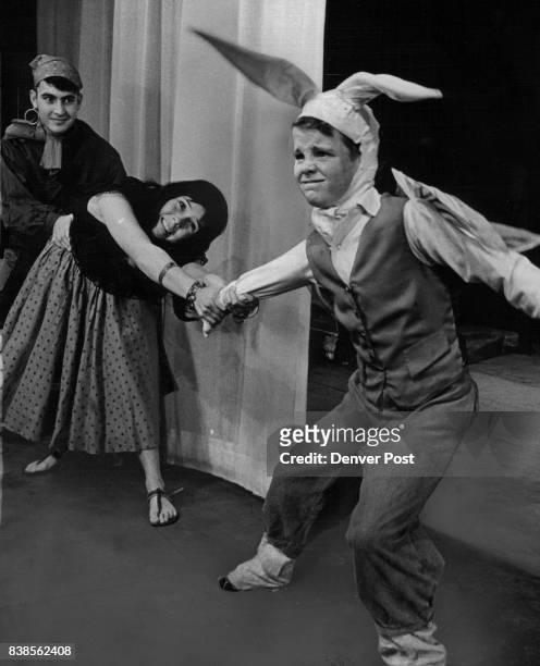 Doug McLauthlin as Little Rabbit tries to escape gypsies Ron Sisneros and Debby Milliken in “The Rabbit Who Wanted Red Wings" at Bonfils Theatre....