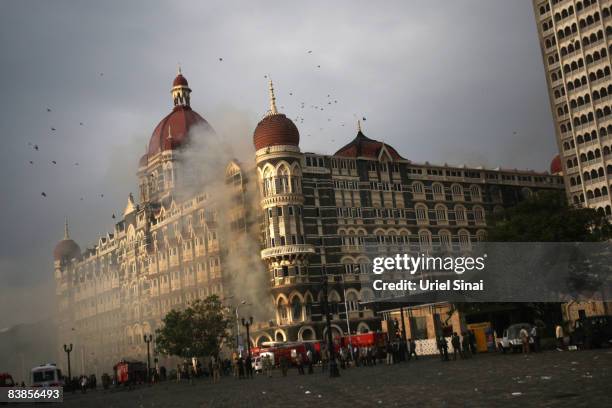 Firefighters attend to a fire as it burns at Taj Mahal Palace & Tower Hotel following an armed siege on November 29, 2008 in Mumbai, India. Indian...