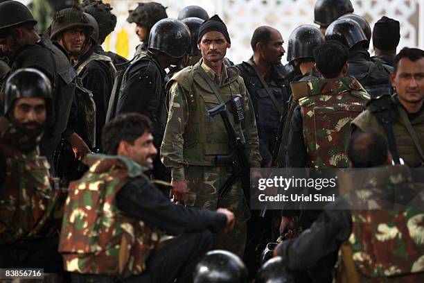 Indian soldiers outside the Taj Mahal Palace & Tower Hotel in Mumbai after it was taken over on November 29, 2008. The city of Mumbai was rocked by...