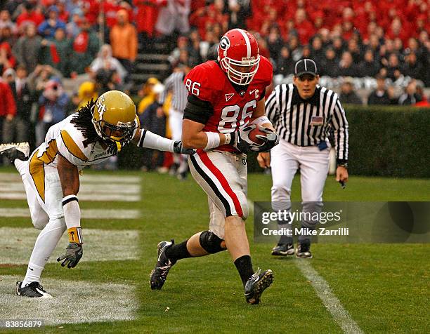 Tight end Tripp Chandler of the Georgia Bulldogs catches a touchdown pass behind safety Morgan Burnett of the Georgia Tech Yellow Jackets during the...