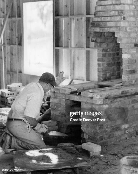 Brick By Brick Al Heeren has only a few more bricks to place before fireplace to provide heat for the forge is completed. Credit: Denver Post