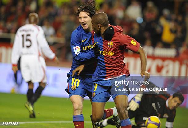 Barcelona's Samuel Eto'o celebrates after scoring against Sevilla's with Lionel Andres Messi during their Spanish league football match at Sanchez...