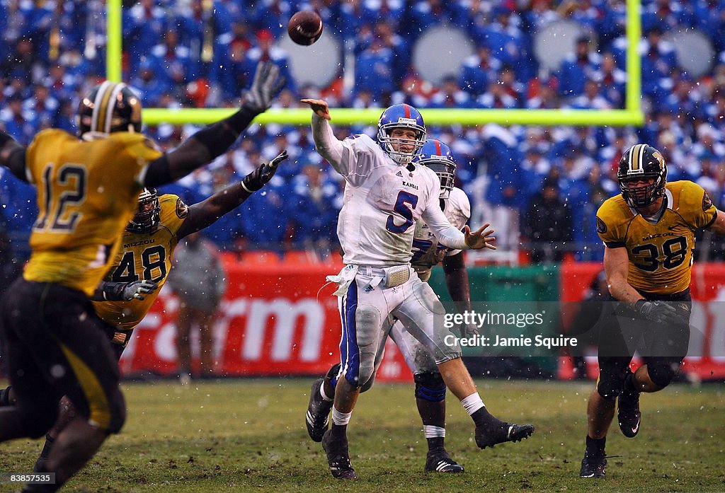 Todd Reesing Dimensional Quarterback Todd Reesing of the Kansas Jayhawks passes during the ...