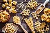 Italian pasta collection on rustic wooden table
