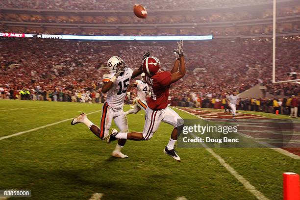 Wide receiver Marquis Maze of the Alabama Crimson Tide makes a touchdown catch over defensive back Neiko Thorpe of the Auburn Tigers at Bryant-Denny...