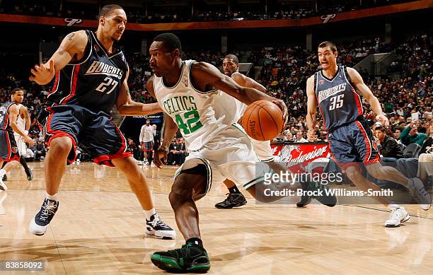 Dwayne Jones of the Charlotte Bobcats guards against Tony Allen of the Boston Celtics on November 29, 2008 at the Time Warner Cable Arena in...