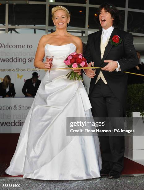 Designer and presenter Laurence Llewelyn-Bowen and wife Jackie, a wedding planner, open the National wedding Show at Earls Court 2, London today.