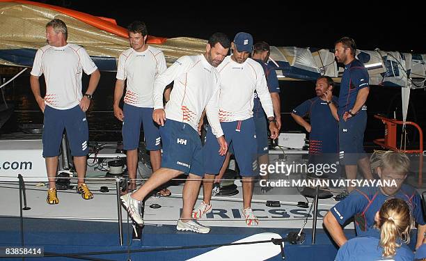 Ericsson 4 skipper Brazilian Torben Grael gets off the boat after arriving in first place at Port Cochin in Cochin early November 30 after victory in...