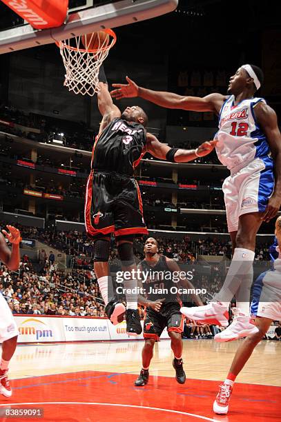 Dwyane Wade of the Miami Heat goes up for a dunk against Al Thornton of the Los Angeles Clippers during their game at Staples Center on November 29,...