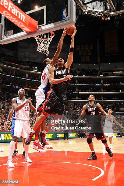 Shawn Marion of the Miami Heat has his shot blocked by Marcus Camby of the Los Angeles Clippers at Staples Center on November 29, 2008 in Los...