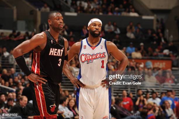 Dwyane Wade of the Miami Heat and Baron Davis of the Los Angeles Clippers stand together during their game at Staples Center on November 29, 2008 in...