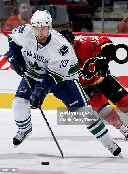 Henrik Sedin of the Vancouver Canucks skates against the Calgary Flames on November 29, 2008 at Pengrowth Saddledome in Calgary, Alberta, Canada.