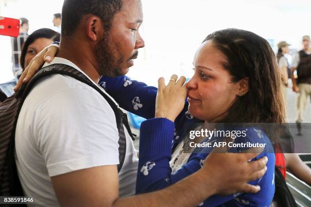 Survivor from a boat wreck, after a ferry sank off the northeastern state of Bahia, reacts upon arrival at the Maritime Terminal of Salvador, Bahia...