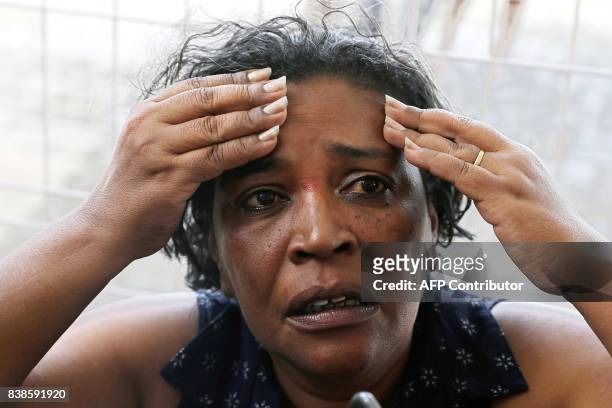 Meire Reis, a survivor from a boat wreck, after a ferry sank off the northeastern state of Bahia, speaks with the press at the Maritime Terminal of...