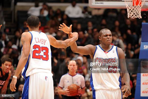 Marcus Camby and Zach Randolph of the Los Angeles Clippers slap hands during their game against the Miami Heat at Staples Center on November 29, 2008...