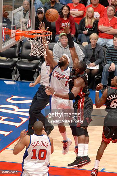 Baron Davis of the Los Angeles Clippers puts up a shot against Dwyane Wade of the Miami Heat at Staples Center on November 29, 2008 in Los Angeles,...