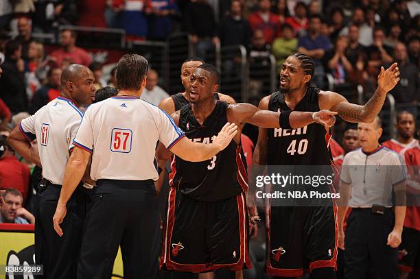 Dwyane Wade and Udonis Haslem of the Miami Heat argue a call during the fourth quarter of their game against the Los Angeles Clippers at Staples...