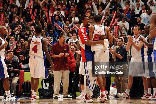 DeAndre Jordan and Marcus Camby of the Los Angeles Clippers embrace following their team's victor over the Miami Heat at Staples Center on November...