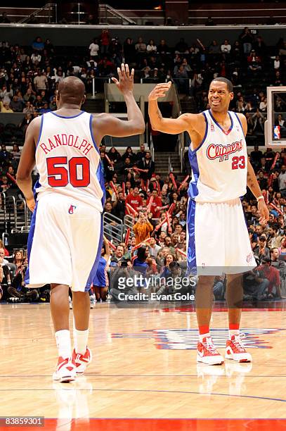 Zach Randolph and Marcus Camby of the Los Angeles Clippers slap hands during their game against the Miami Heat at Staples Center on November 29, 2008...