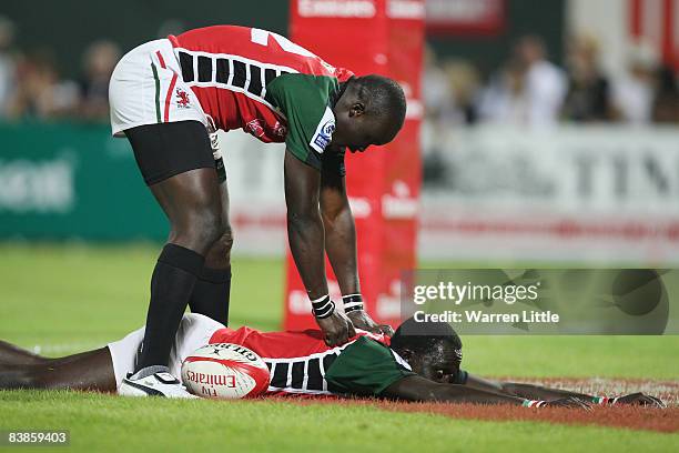 Humphrey Kayange of Kenya dives over tyo score a try against Samoa in the Plate Final of the Emirates Airline Dubai Sevens at The Sevens on November...