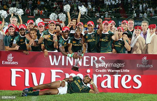 The South African team celebrate with the trophy after beating England to win the 2008 Emirates Airline Dubai Sevens at The Sevens on November 29,...