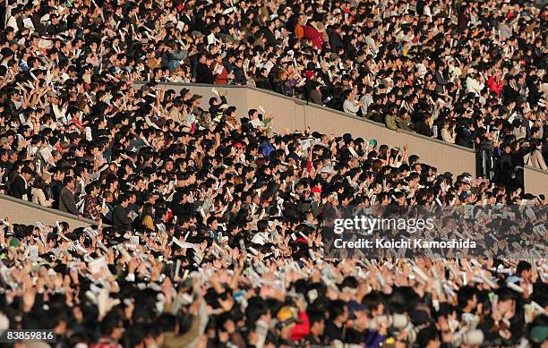 Japanese horse race fans watch the Japan Cup 2008 at Tokyo Racecourse on November 30, 2008 in Tokyo, Japan.