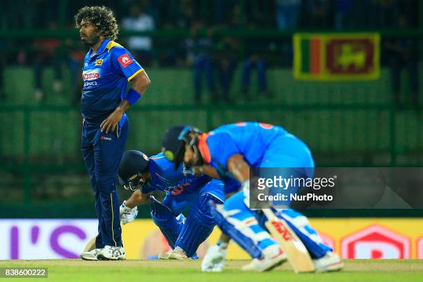 Sri Lankan cricketer and fast bowler Lasith Malinga looks on during the 2nd One Day International cricket match between Sri Lanka and India at the...