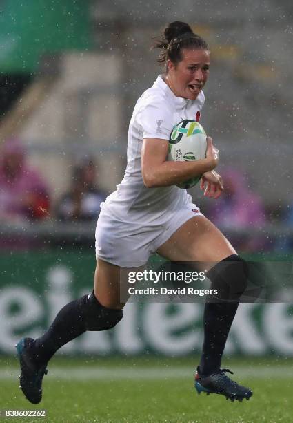 Emily Scarratt of England runs with the ball during the Women's Rugby World Cup 2017 semi final match between England and France at the Kingspan...