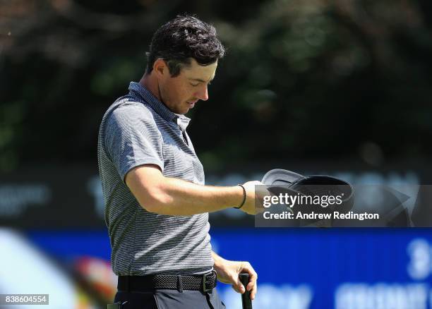 Rory McIlroy of Northern Ireland reacts after putting on the 18th green during round one of The Northern Trust at Glen Oaks Club on August 24, 2017...