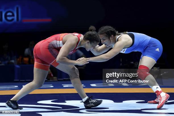 France's Koumba Selene Fanta Larroque competes for the bronze medal against Austria's Martina Kuenz during the women's freestyle wrestling -69kg...