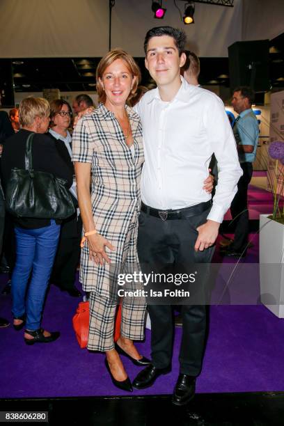 German politician Yvonne Gebauer and her son Victor Gebauer pass through the Gamescom 2017 gaming trade fair on August 22, 2017 in Cologne, Germany....