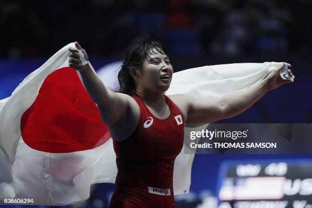 Japan's Sara Dosho celebrates after winning the women's freestyle wrestling -69kg category final at the FILA World Wrestling Championships in Paris...