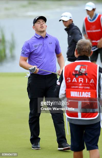 Matt Wallace of England reacts on the 18th hole during day one of Made in Denmark at Himmerland Golf & Spa Resort on August 24, 2017 in Aalborg,...